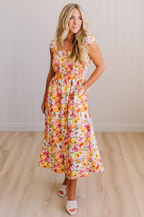 DARLING FLORAL MAXI DRESS FEATURES:
- COTTON FLORAL PRINT FABRICATION
- FLORAL EMBROIDERY MOTIF AT FRONT BUST
- RUFFLED SHOULDERS
- HIDDEN SIDE ZIPPER
- SIDE POCKETS
- SMOCKED BACK BODICE
- LACE INSET FLOUNCE
- FULL LINING