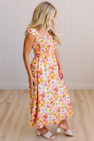 DARLING FLORAL MAXI DRESS FEATURES:
- COTTON FLORAL PRINT FABRICATION
- FLORAL EMBROIDERY MOTIF AT FRONT BUST
- RUFFLED SHOULDERS
- HIDDEN SIDE ZIPPER
- SIDE POCKETS
- SMOCKED BACK BODICE
- LACE INSET FLOUNCE
- FULL LINING