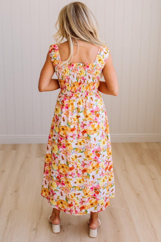 DARLING FLORAL MAXI DRESS FEATURES:
- COTTON FLORAL PRINT FABRICATION
- FLORAL EMBROIDERY MOTIF AT FRONT BUST
- RUFFLED SHOULDERS
- HIDDEN SIDE ZIPPER
- SIDE POCKETS
- SMOCKED BACK BODICE
- LACE INSET FLOUNCE
- FULL LINING