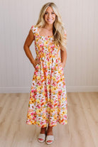 DARLING FLORAL MAXI DRESS FEATURES:
- COTTON FLORAL PRINT FABRICATION
- FLORAL EMBROIDERY MOTIF AT FRONT BUST
- RUFFLED SHOULDERS
- HIDDEN SIDE ZIPPER
- SIDE POCKETS
- SMOCKED BACK BODICE
- LACE INSET FLOUNCE
- FULL LINING