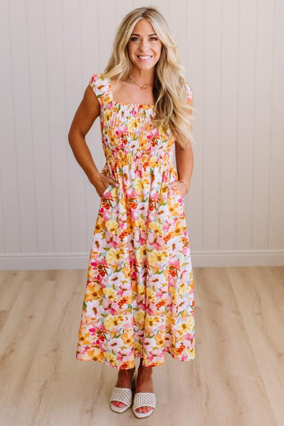 DARLING FLORAL MAXI DRESS FEATURES:
- COTTON FLORAL PRINT FABRICATION
- FLORAL EMBROIDERY MOTIF AT FRONT BUST
- RUFFLED SHOULDERS
- HIDDEN SIDE ZIPPER
- SIDE POCKETS
- SMOCKED BACK BODICE
- LACE INSET FLOUNCE
- FULL LINING