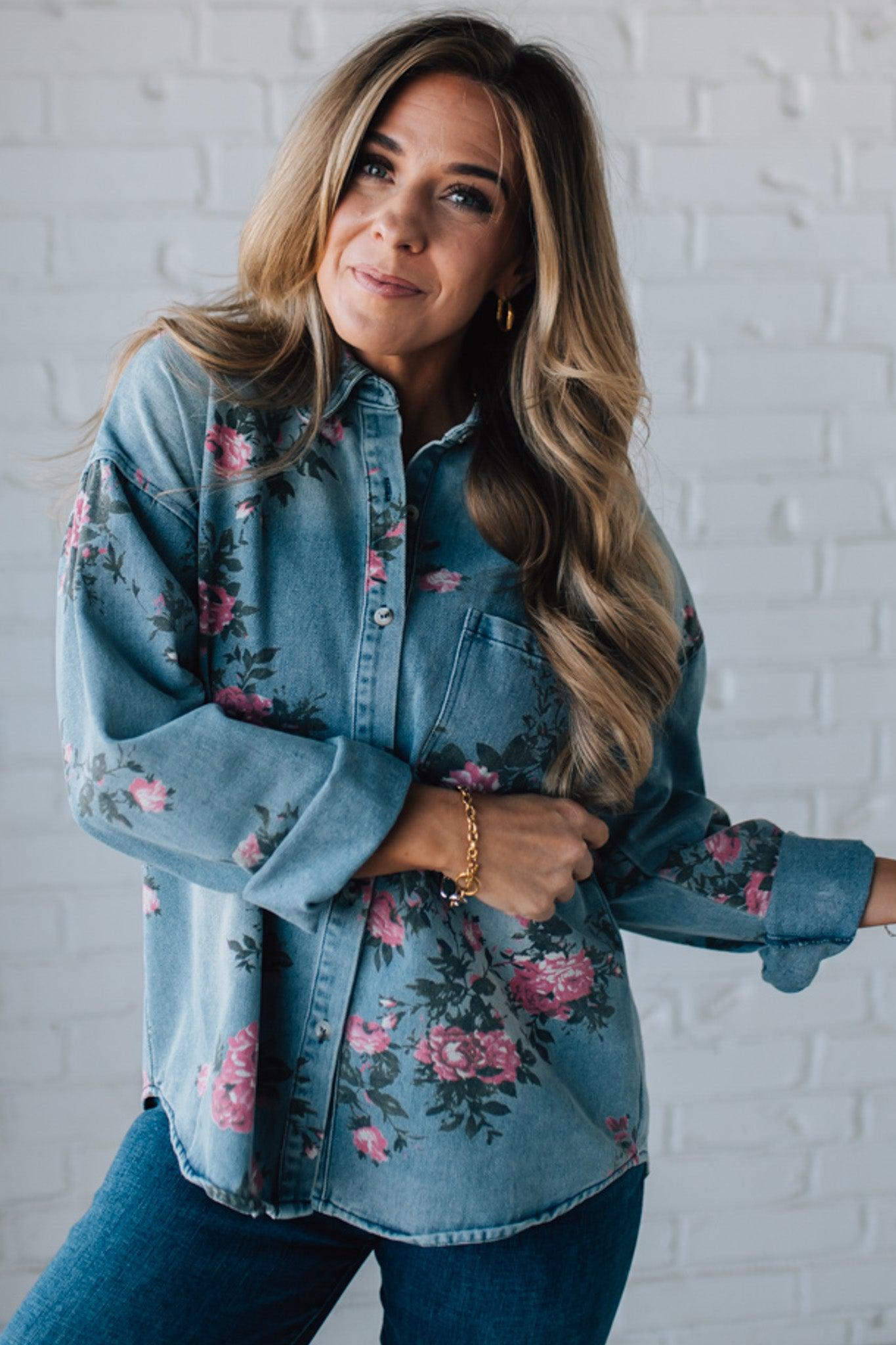 blonde girl modeling a long sleeve button front denim top with pink floral pattern