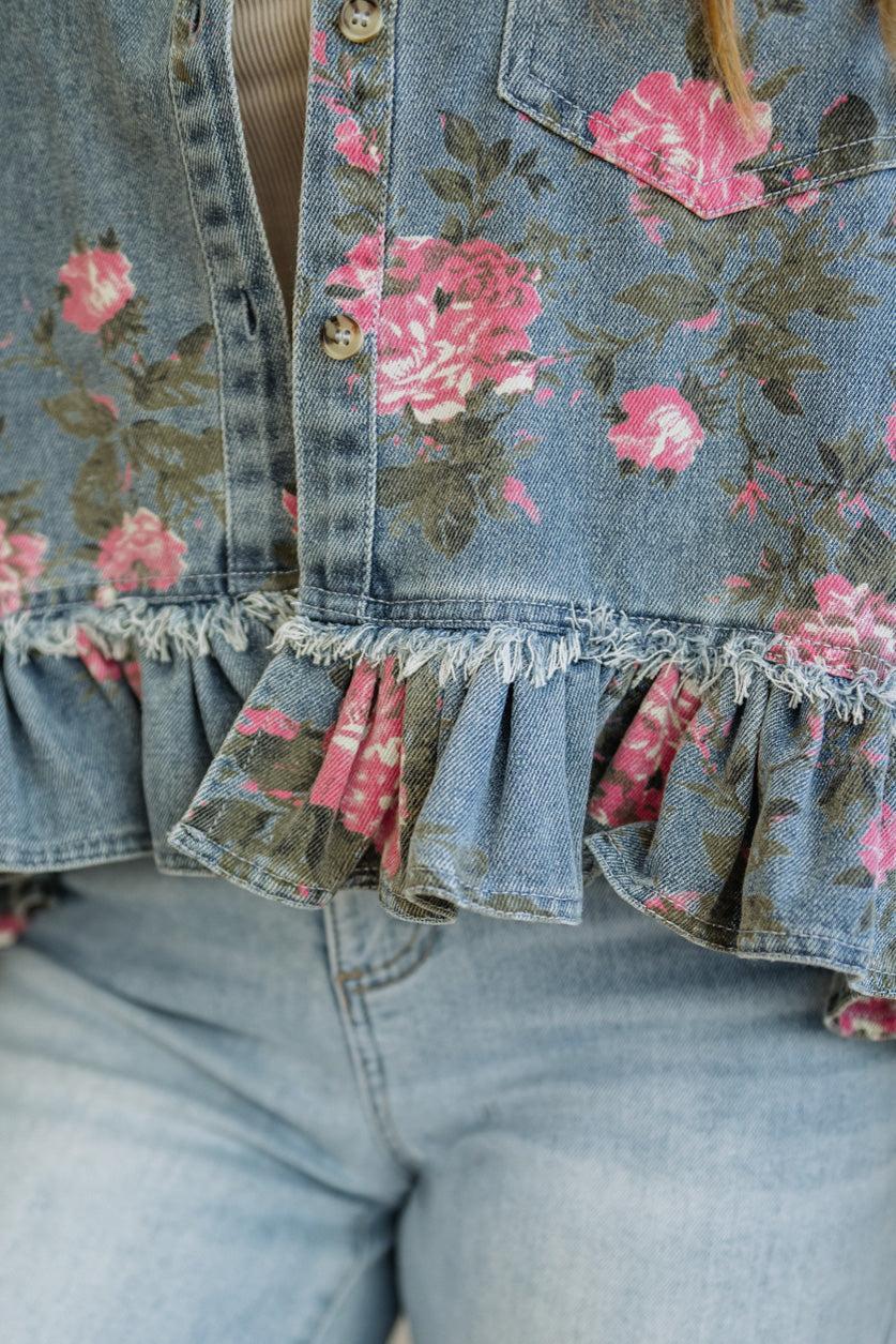 Denim jacket with floral patterns and ruffled hem