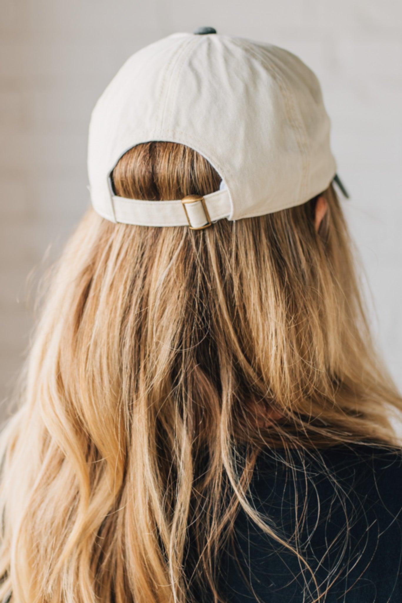 Blonde woman wearing a hat with Go Sports Embroidered at the front of the  Two Tone Baseball Cap.