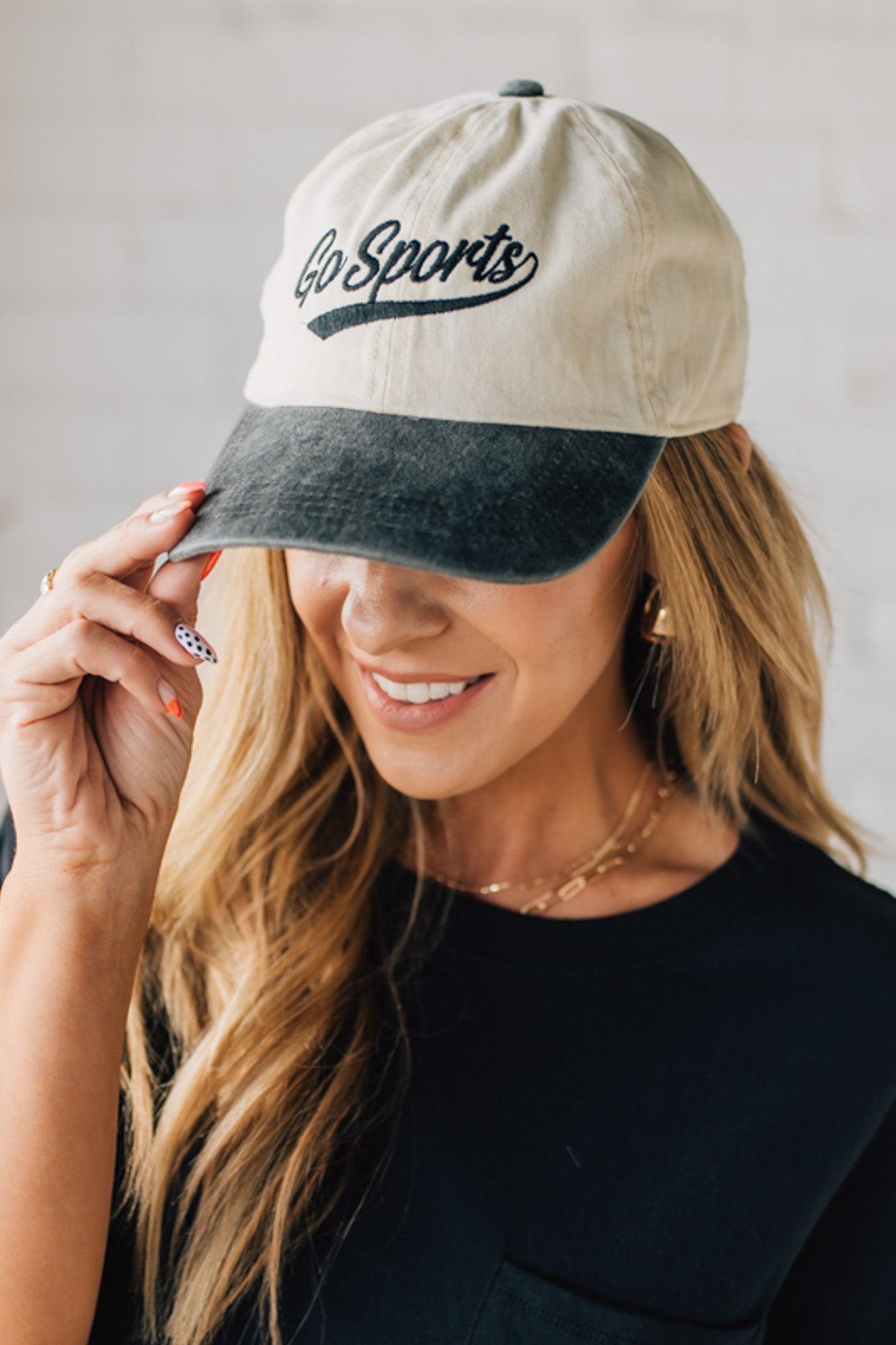 Blonde woman wearing a hat with Go Sports Embroidered at the front of the  Two Tone Baseball Cap.