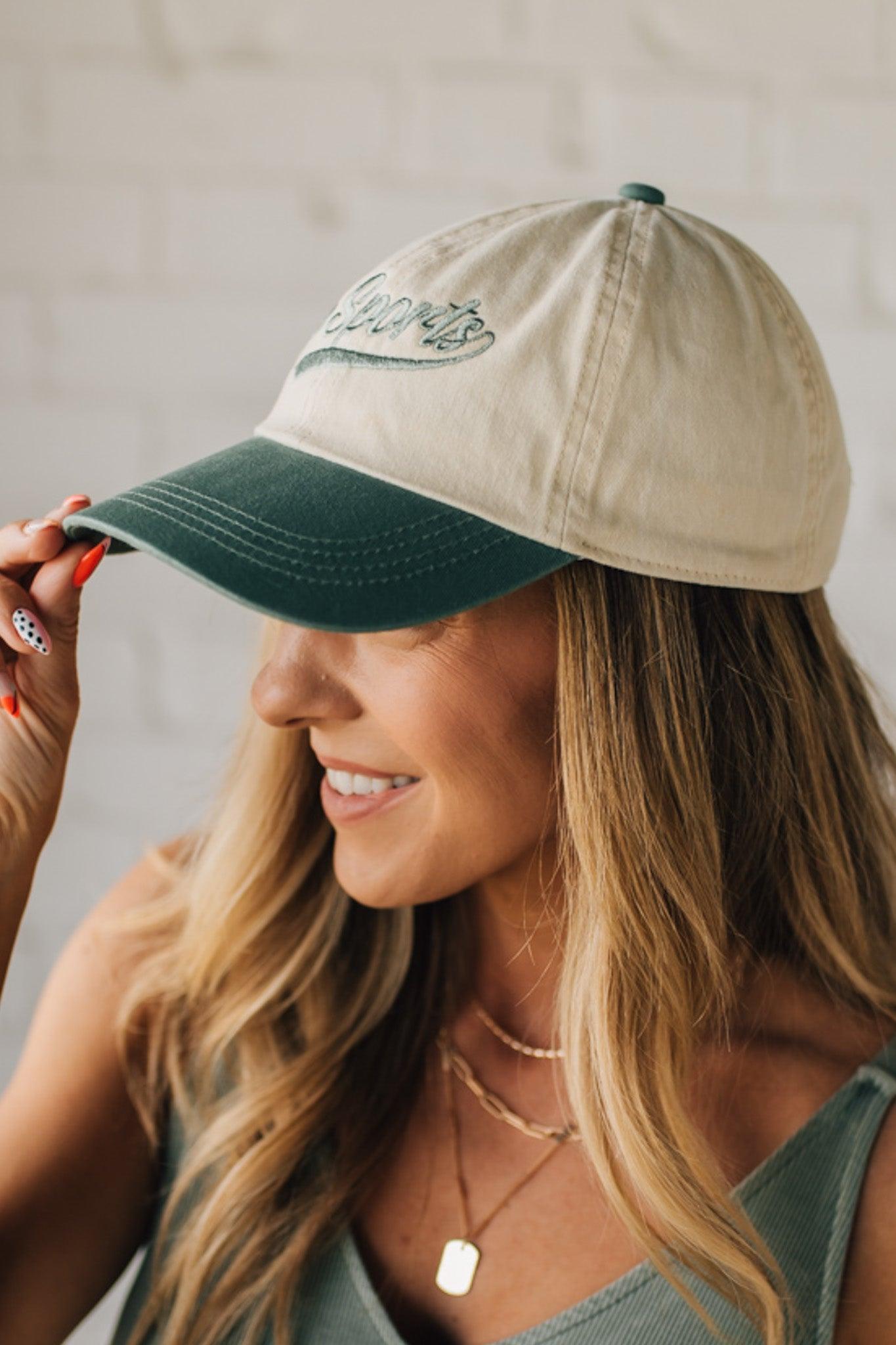 Blonde woman wearing a hat with Go Sports Embroidered at the front of the  Two Tone Baseball Cap.