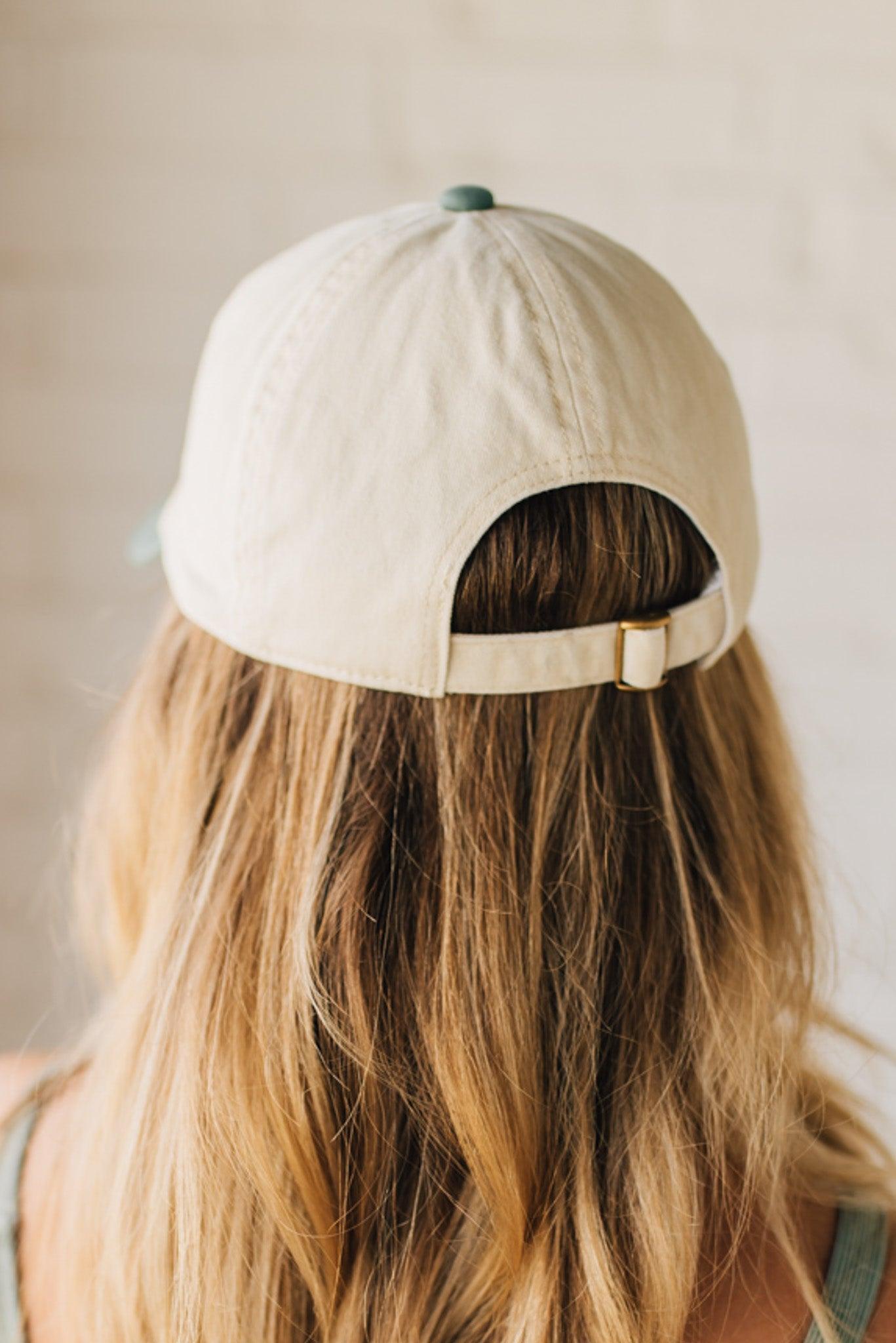 Blonde woman wearing a hat with Go Sports Embroidered at the front of the  Two Tone Baseball Cap.