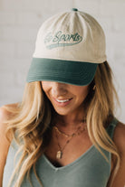 Blonde woman wearing a hat with Go Sports Embroidered at the front of the  Two Tone Baseball Cap.