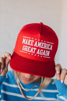 Red hat on a blonde woman with Americana theme.