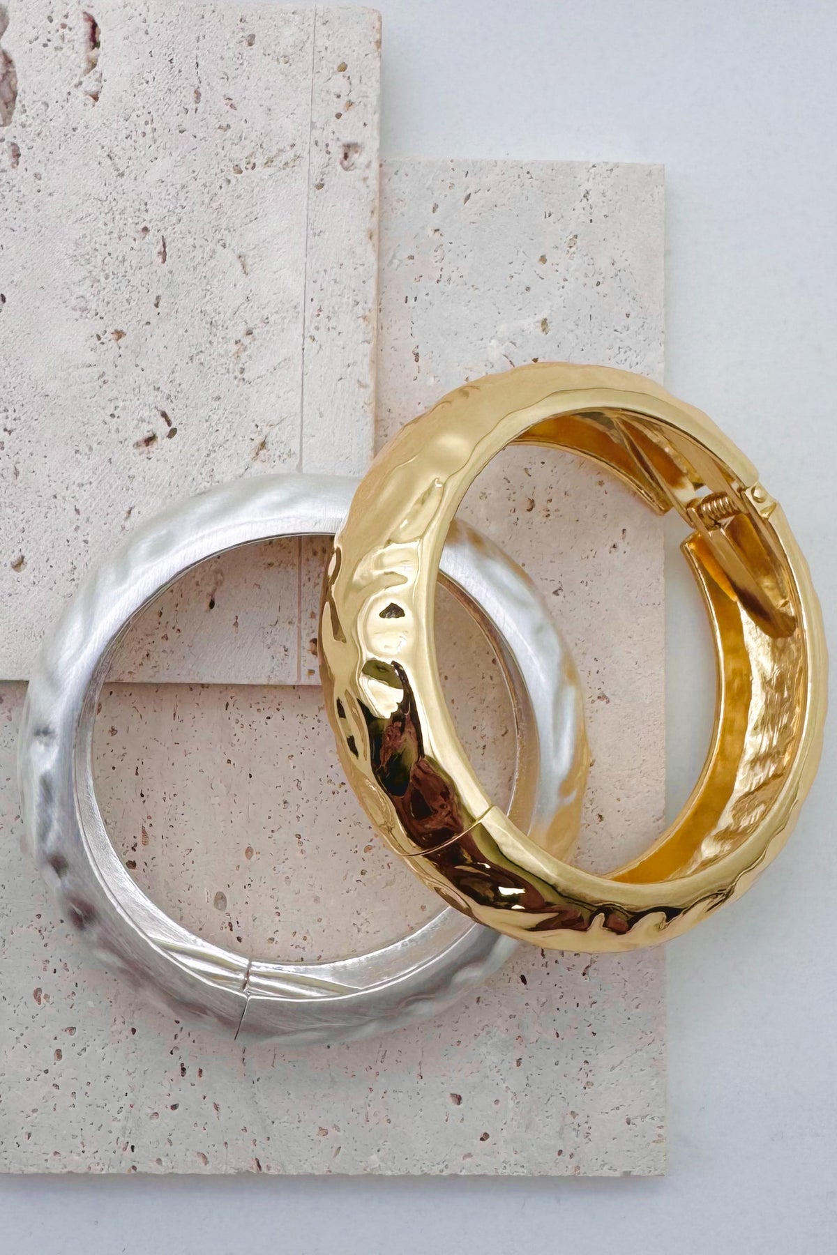 Pile of mixed metal bangle bracelets.