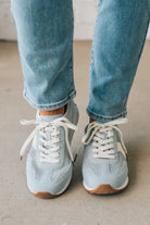 Women's Light Blue Mesh Sneakers with Cream Laces and Accents.