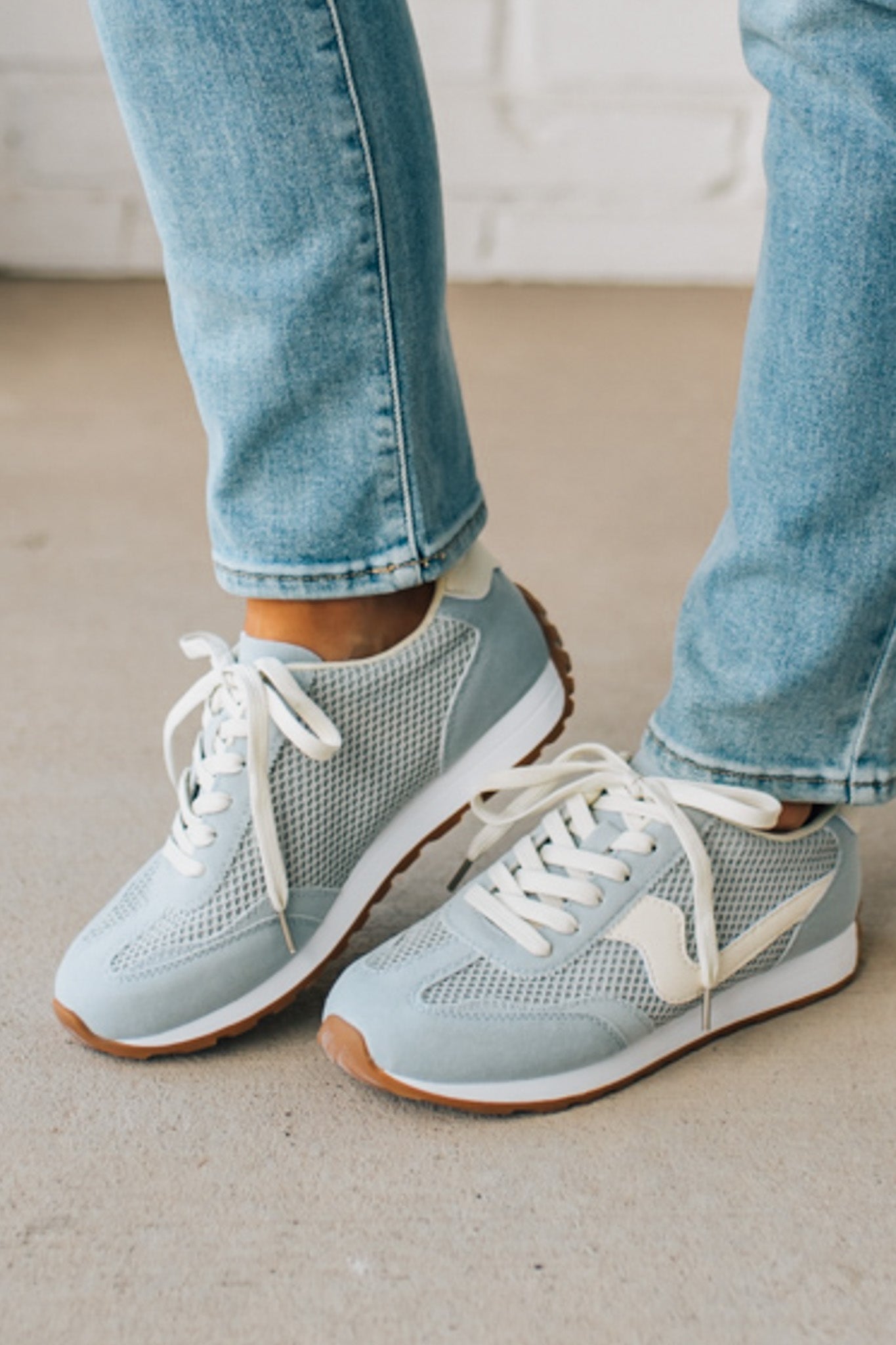 Women's Light Blue Mesh Sneakers with Cream Laces and Accents.