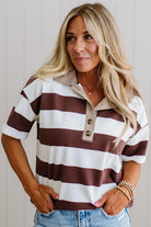 Woman wearing a brown and white striped polo shirt with a neutral background