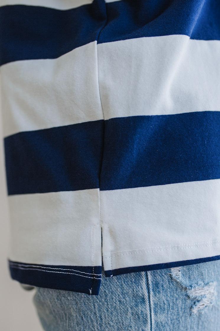 Close-up of a blue and white striped shirt with a blurred background