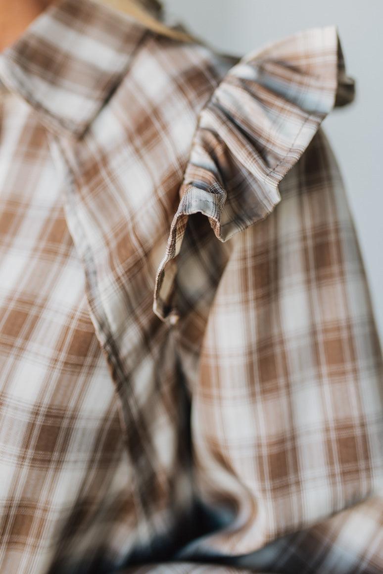 Close-up of a plaid shirt with a blurred background