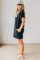 Blonde Woman Wearing a Black Premium Cotton T-shirt Dress With Pockets.