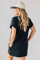 Blonde Woman Wearing a Black Premium Cotton T-shirt Dress With Pockets.