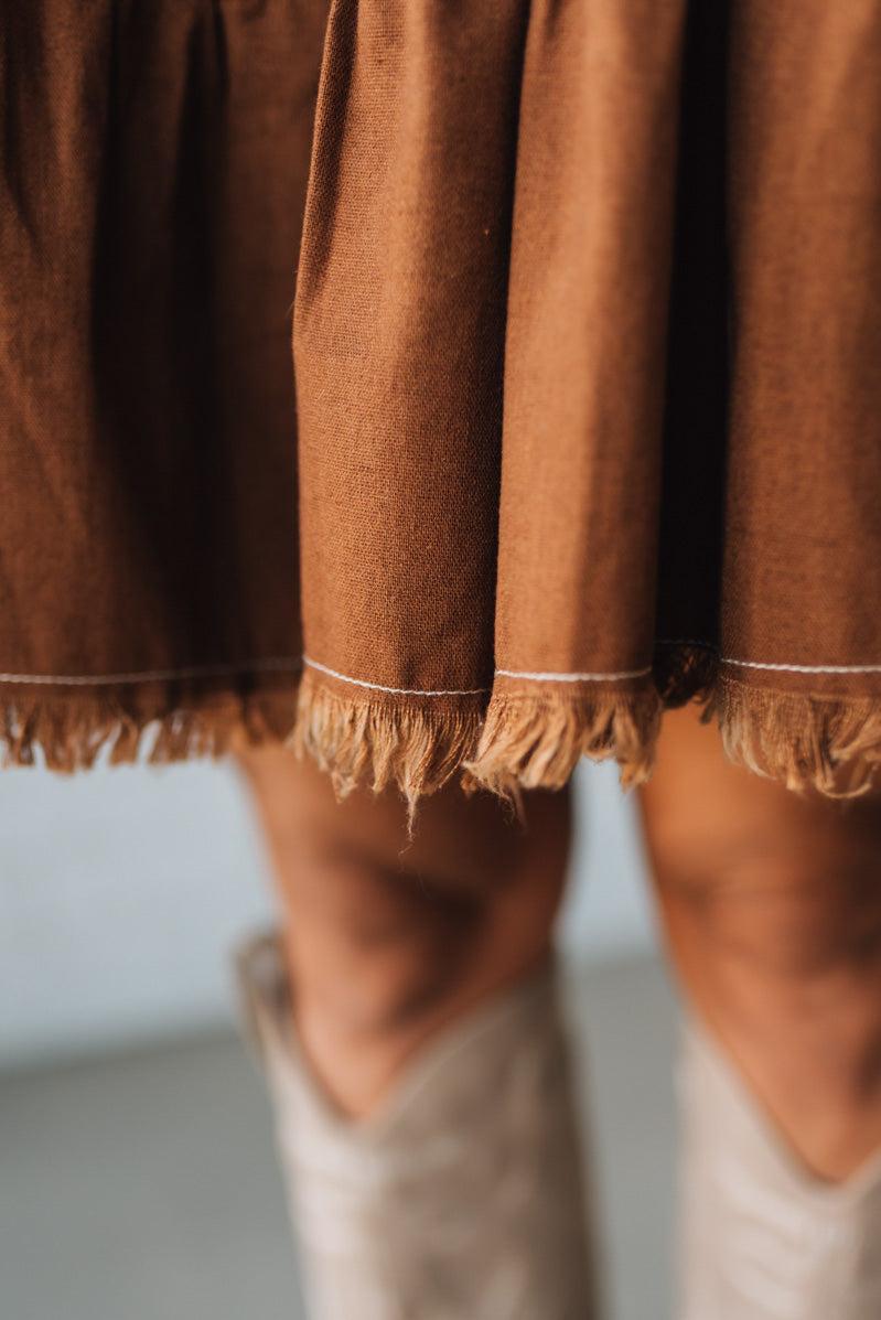 Linen Button Up Shirt Dress with a Ruffled Gathered Sleeve and Frayed Hem Details
