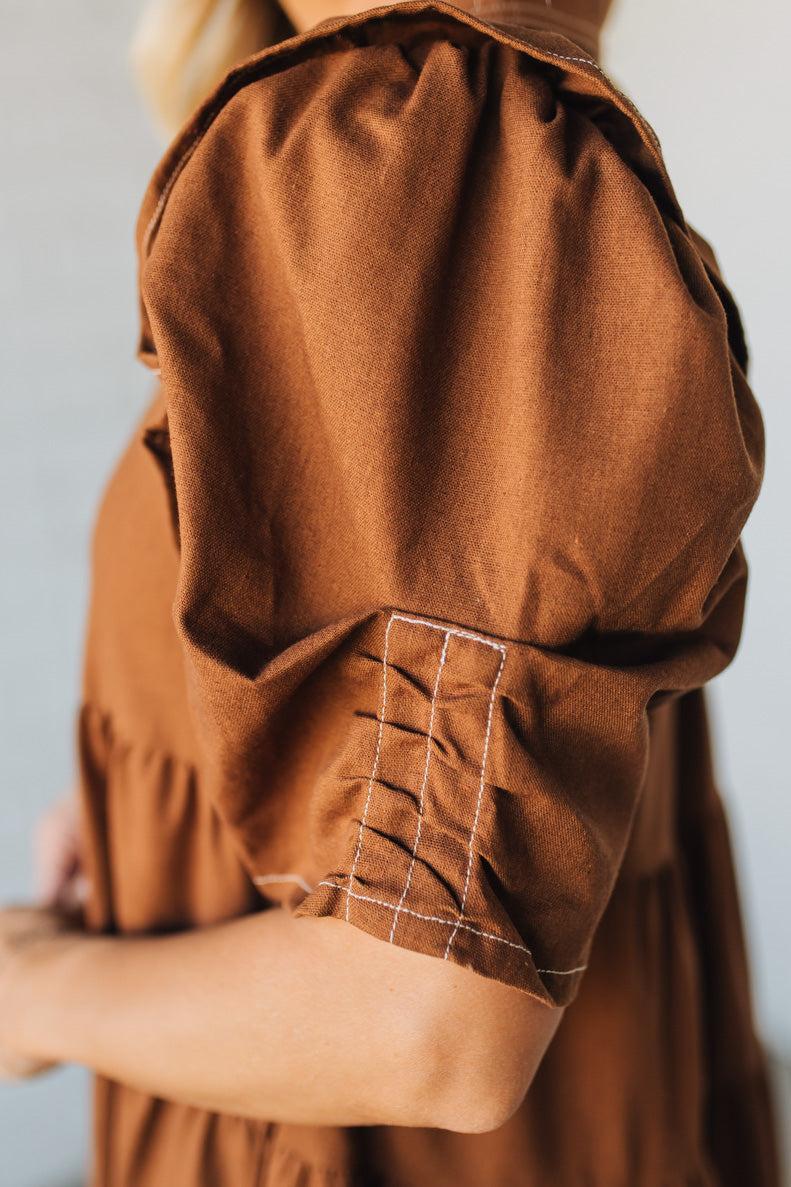 Linen Button Up Shirt Dress with a Ruffled Gathered Sleeve and Frayed Hem Details
