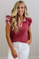 Blonde woman wearing a Striped accent Frill Split Neck Scuba Top