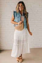 Blonde woman wearing a Woven Macrame Design crossbody bag.