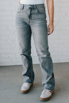 Super high rise dad jeans in grey wash with fading, whiskers, five-pocket design, belt loops, and hidden zip fly with button closure.