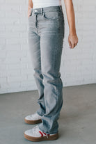 Super high rise dad jeans in grey wash with fading, whiskers, five-pocket design, belt loops, and hidden zip fly with button closure.