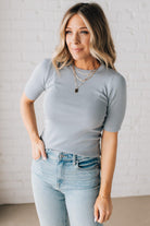 Blonde woman wearing half sleeve lightweight viscose sweater tee.