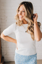 Blonde woman wearing half sleeve lightweight viscose sweater tee.