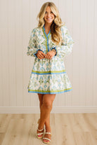 Woman wearing a floral dress with a white background