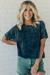women wearing a black mineral wash short sleeve boxy fit tee shirt