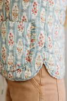 Close-up of a floral patterned fabric with a neutral background