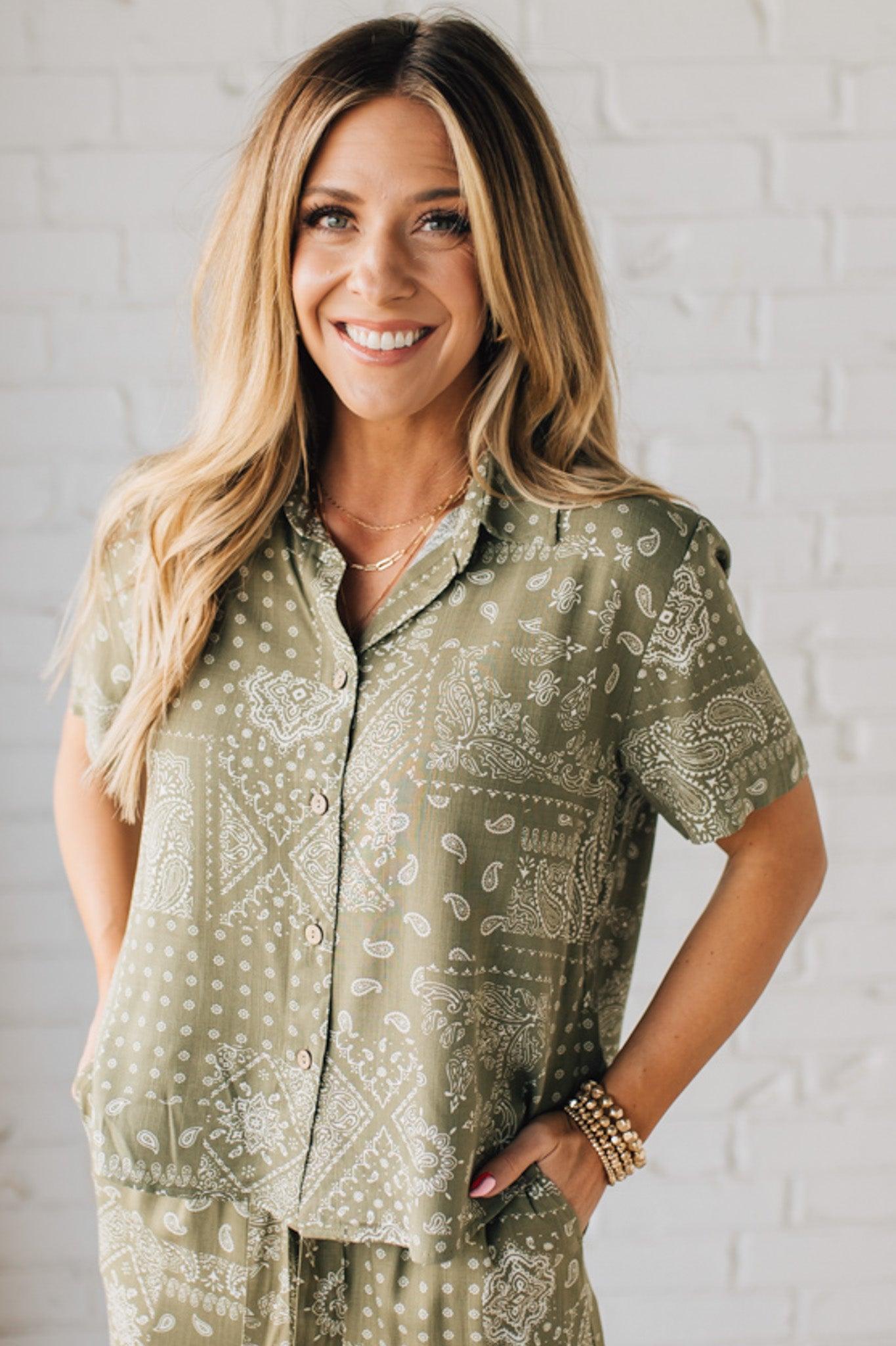 Blonde Woman Wearing a Loose Fit Paisley Print Button Front Top with Center Back Pleat and Lay Flat Collar.