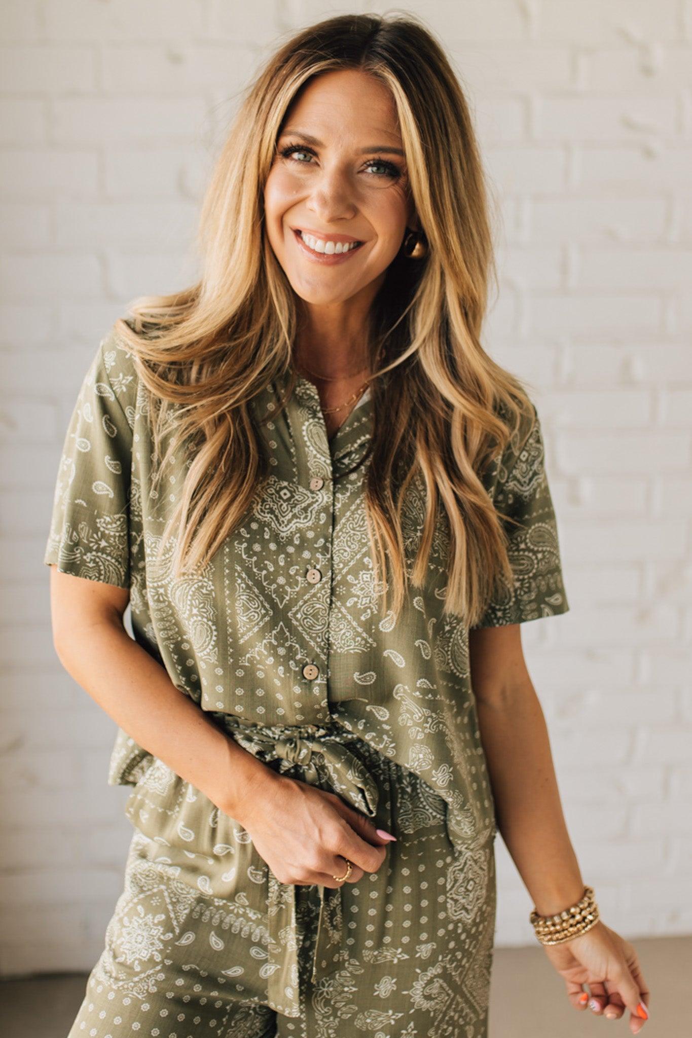 Blonde Woman Wearing a Loose Fit Paisley Print Button Front Top with Center Back Pleat and Lay Flat Collar.
