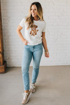 Blonde Woman Wearing a Round Neck Short Sleeve Dog Graphic Sweater.