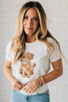 Blonde Woman Wearing a Round Neck Short Sleeve Dog Graphic Sweater.