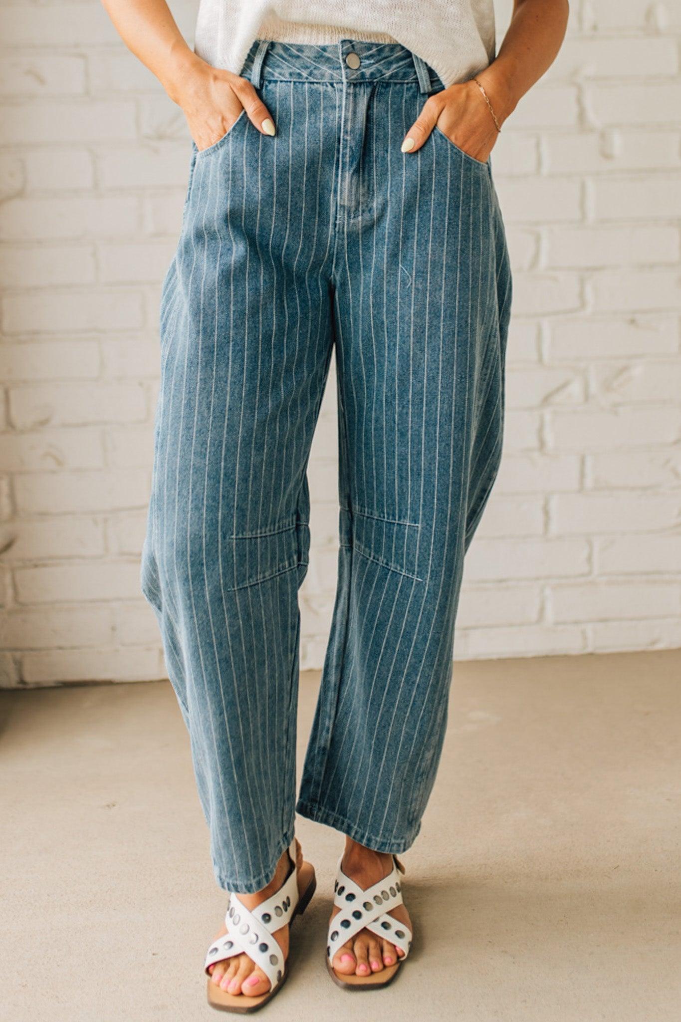 Blonde Woman in Sandals wearing Washed Stripe Denim Mid Rise Barrel Pants.