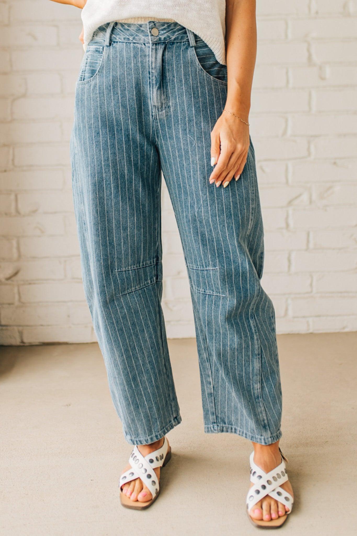 Blonde Woman in Sandals wearing Washed Stripe Denim Mid Rise Barrel Pants.