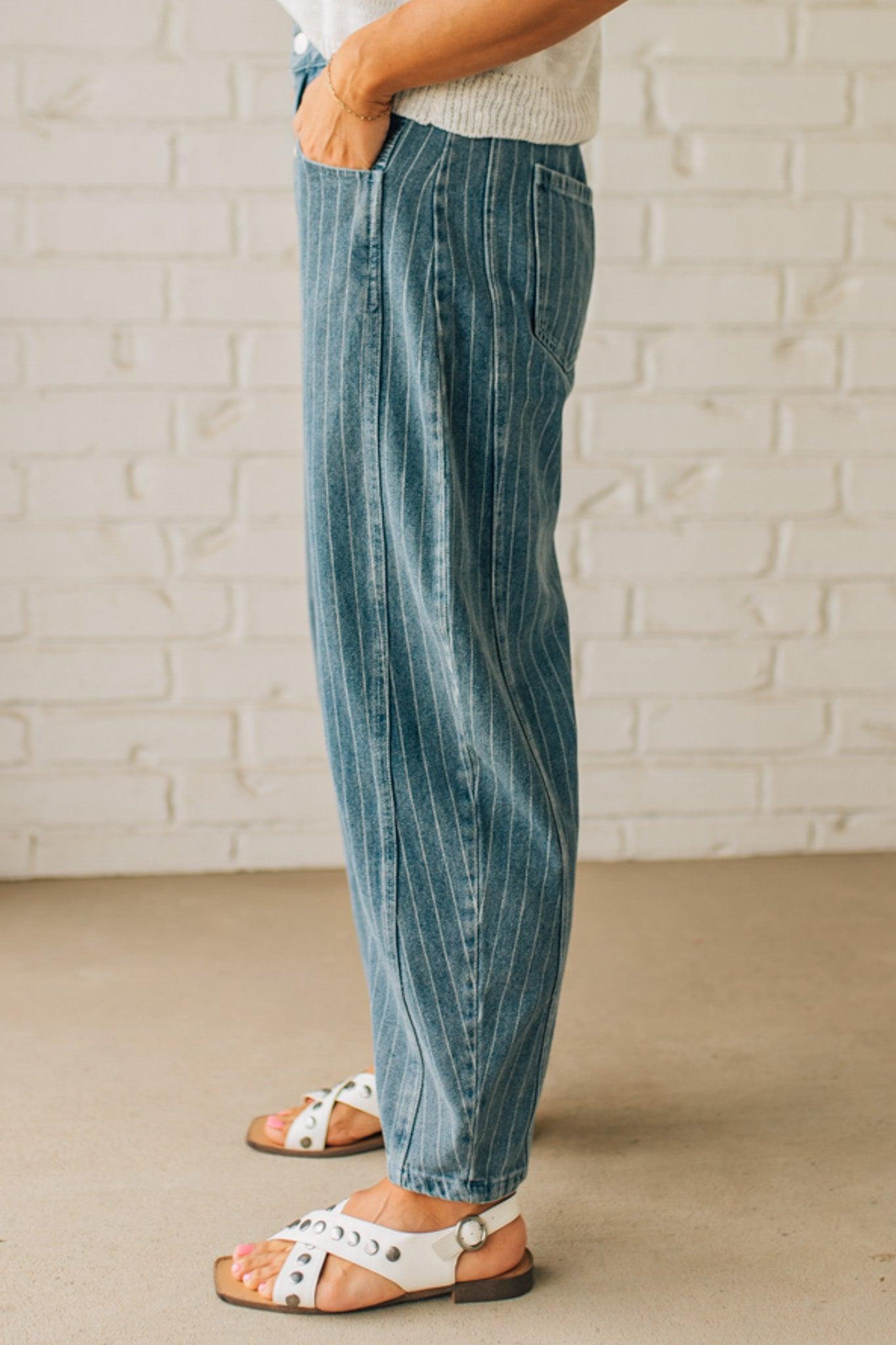 Blonde Woman in Sandals wearing Washed Stripe Denim Mid Rise Barrel Pants.