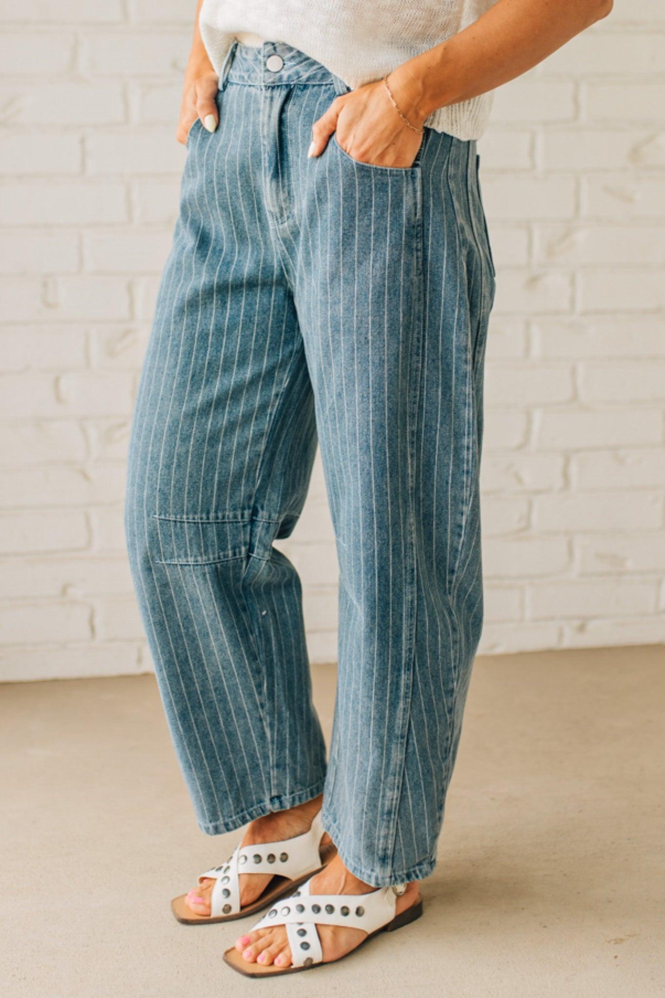 Blonde Woman in Sandals wearing Washed Stripe Denim Mid Rise Barrel Pants.