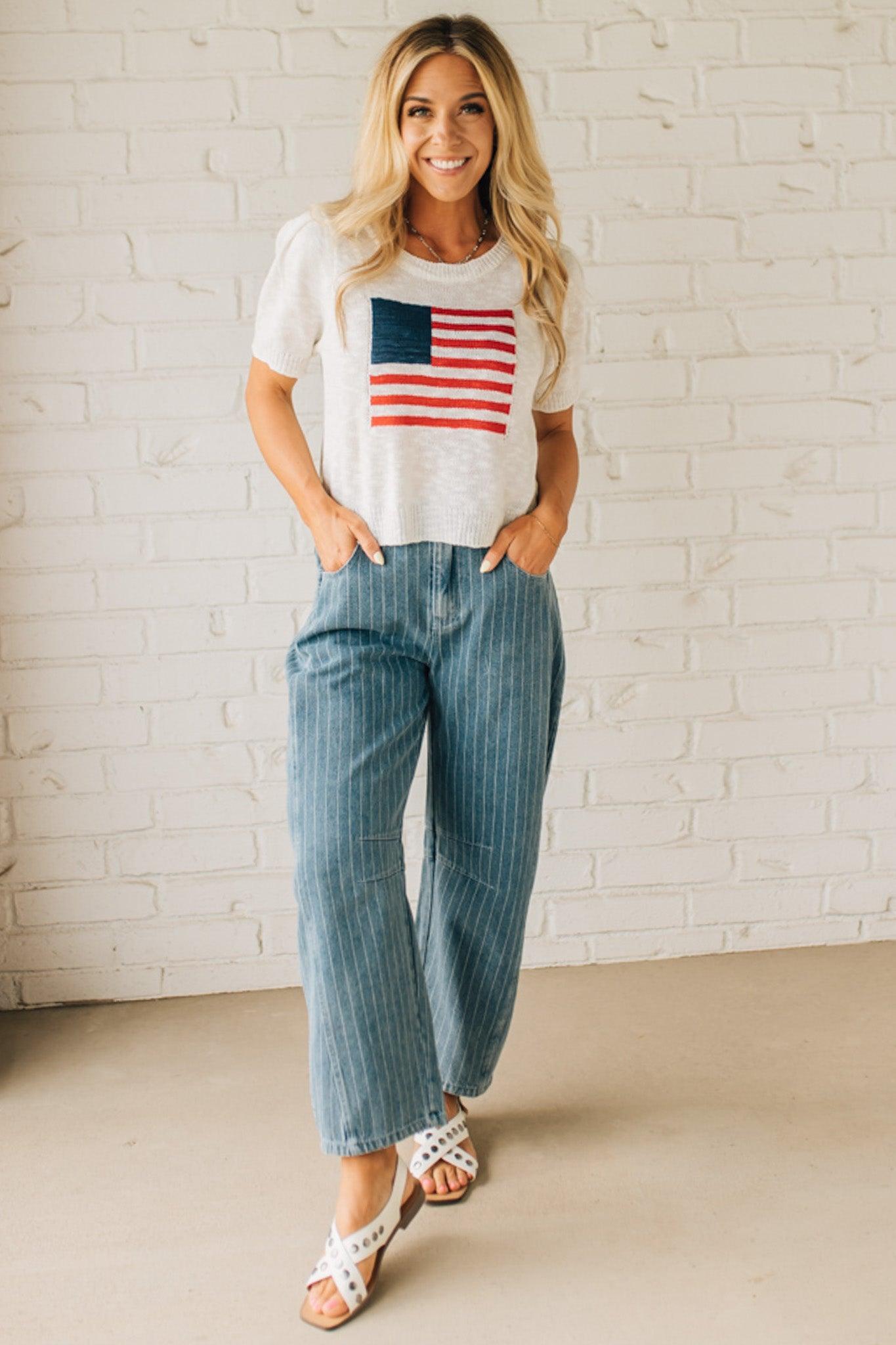 Blonde Woman in Sandals wearing Washed Stripe Denim Mid Rise Barrel Pants.