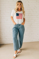 Blonde Woman in Sandals wearing Washed Stripe Denim Mid Rise Barrel Pants.