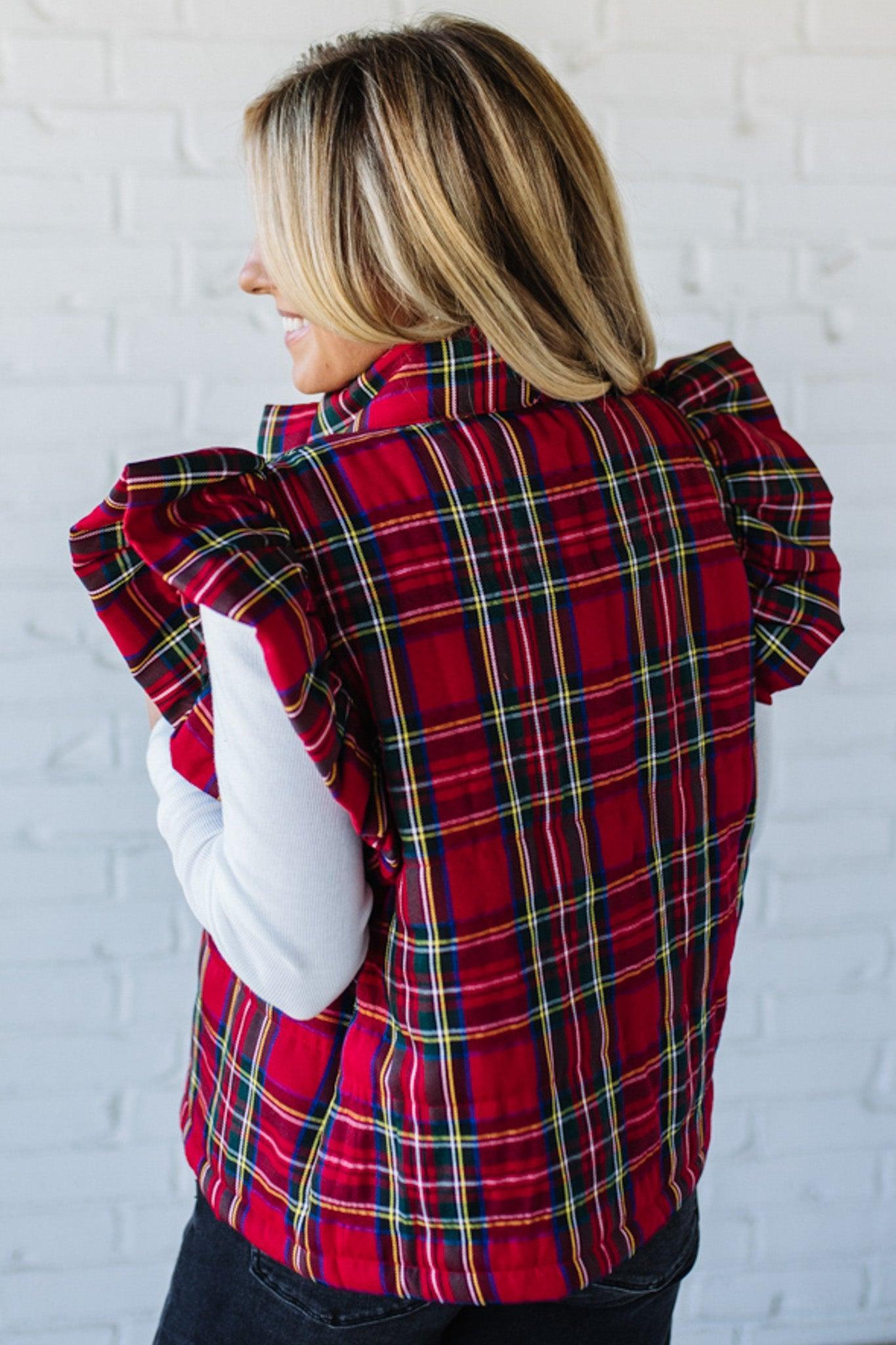 Blonde Woman Wearing a Red Christmas Plaid Ruffled Puffer Vest.