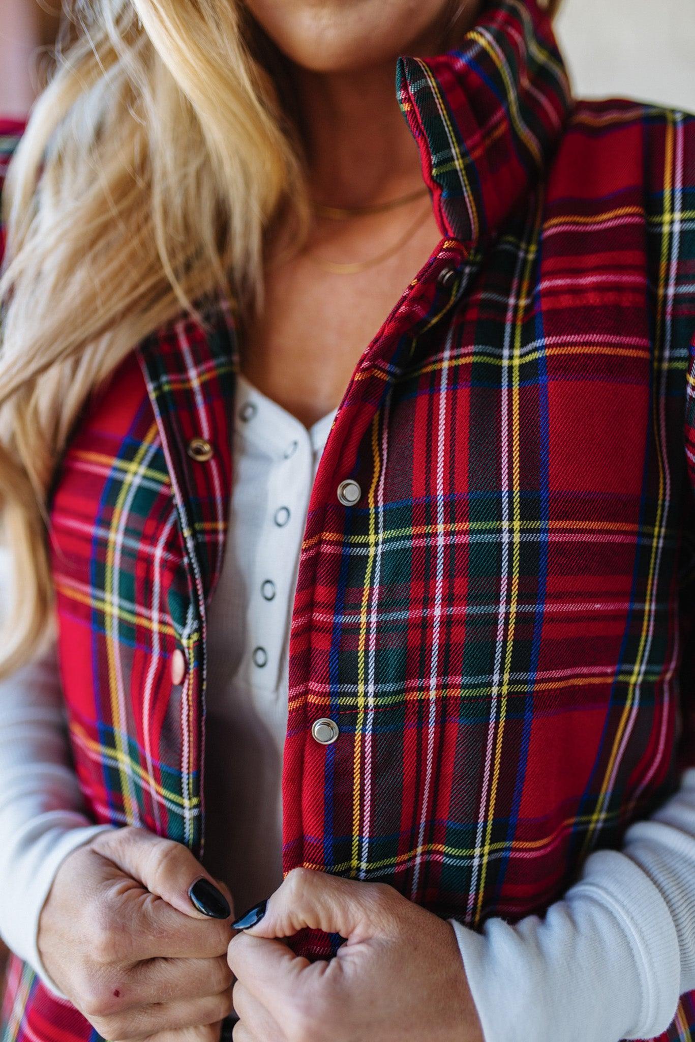 Blonde Woman Wearing a Red Christmas Plaid Ruffled Puffer Vest.