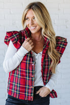 Blonde Woman Wearing a Red Christmas Plaid Ruffled Puffer Vest.