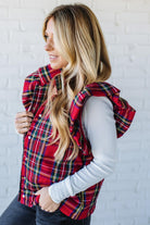 Blonde Woman Wearing a Red Christmas Plaid Ruffled Puffer Vest.