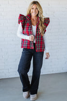 Blonde Woman Wearing a Red Christmas Plaid Ruffled Puffer Vest.