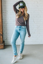 Blonde Woman Wearing A Solid Washed Basic Scoop Neck Ribbed Tee.