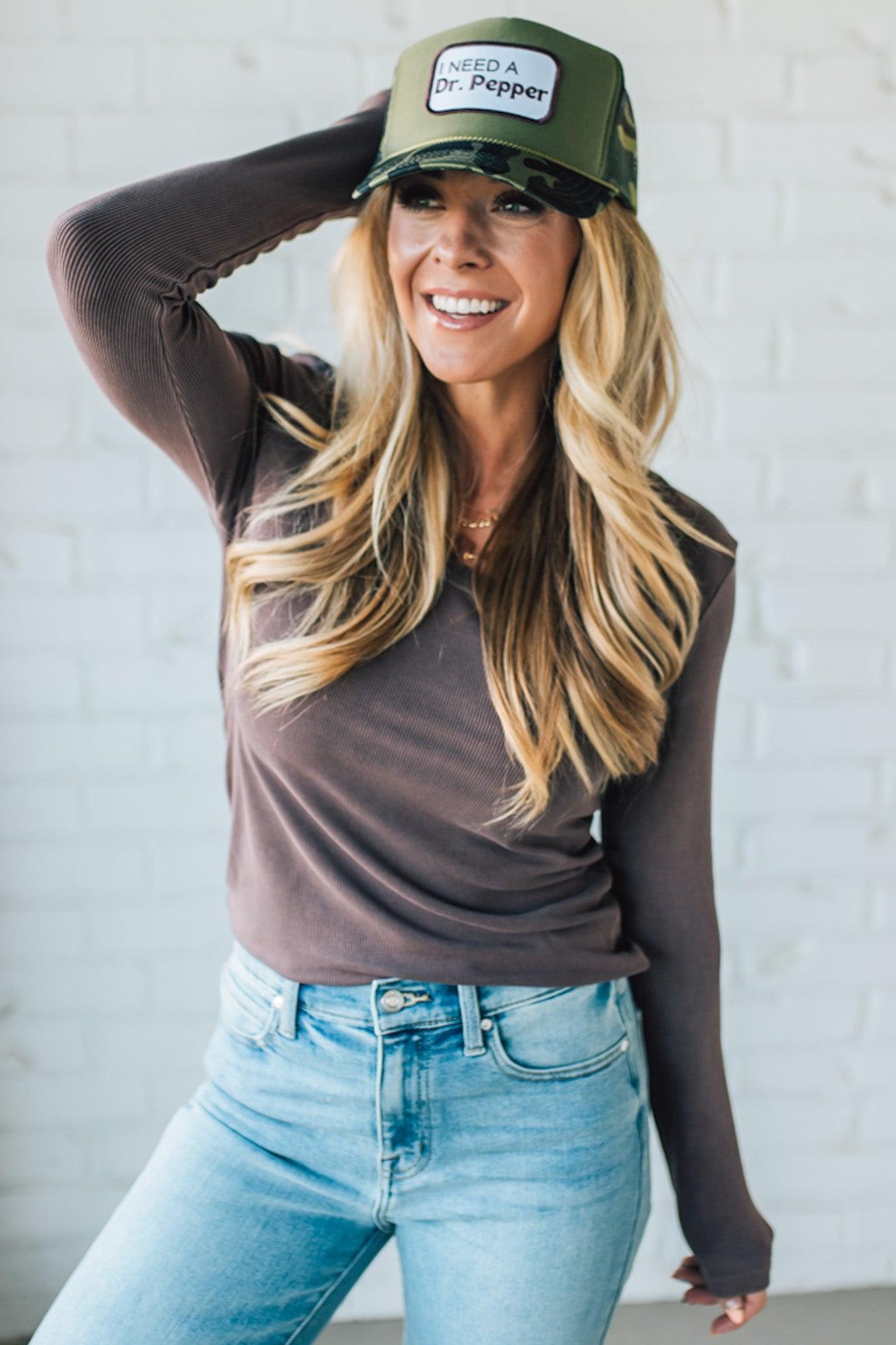 Blonde Woman Wearing A Solid Washed Basic Scoop Neck Ribbed Tee.