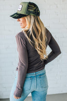 Blonde Woman Wearing A Solid Washed Basic Scoop Neck Ribbed Tee.